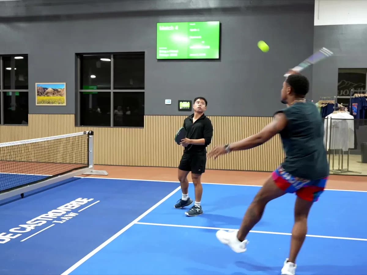 Competitive group pickleball match at The Courts LV